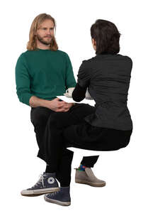cut out man and woman sitting face to face