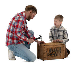 father and son building a crate together