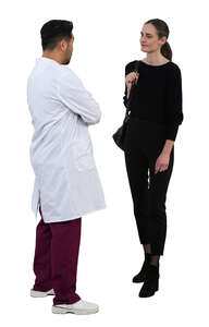 woman standing talking to a doctor