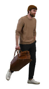 bearded man with a brown leather bag walking