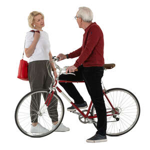 grey haired man with a bike talking to a woman