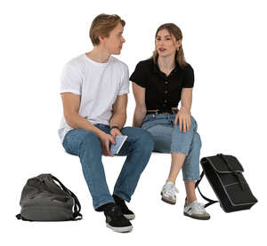two young people sitting and discussing