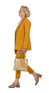 woman in a yellow suit walking
