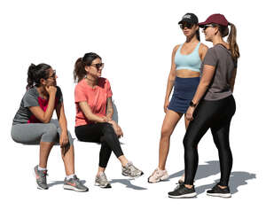 women resting and talking after workout