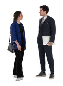 man and woman standing and discussing business matters