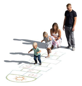 top view of a family with little children playing hopscotch