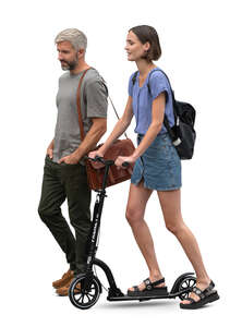 man walking side by side with a woman riding a scooter 