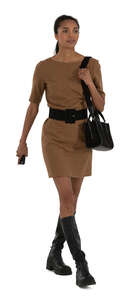woman in a brown mini dress walking