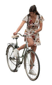 woman starting to ride a bicycle