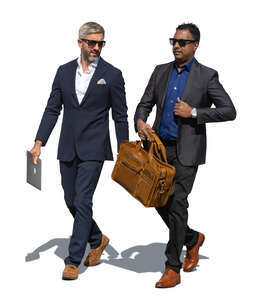 two cut out businessmen walking outside in the street