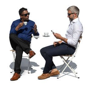 two men sitting in an outdoor coffeeshop and talking