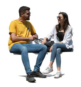 two middle eastern people sitting and talking