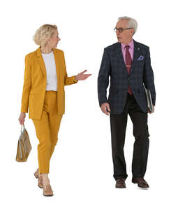 two cut out senior business people walking and talking