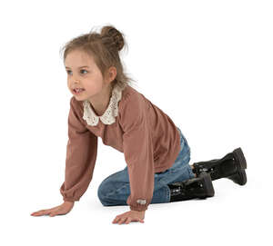 cut out little girl sitting on the floor and playing