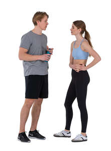man and woman talking after a workout