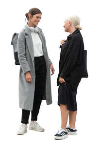 two women standing and talking