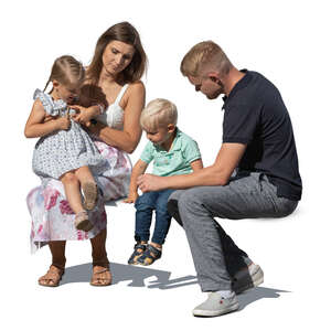 cut out family with two little children sitting