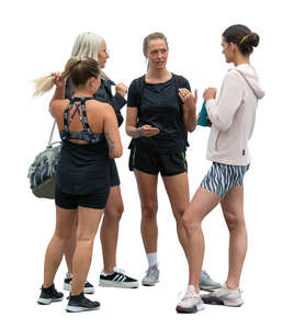 four women coming from workout and talking