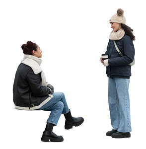 two cut out women in winter talking