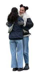 two cut out women hugging in winter