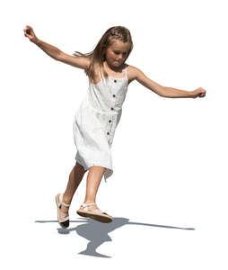 cut out little girl in a white dress playing