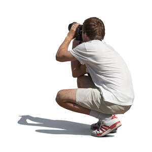 cut out man squatting and taking pictures