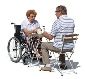 elderly couple sitting in a cafe