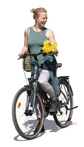 woman holding flowers and riding a bike