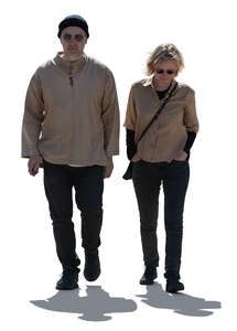 two cut out backlit people walking
