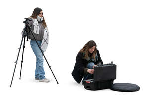 two cut out women preparing for a photo shoot