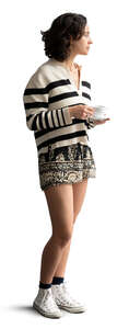 woman drinking coffee and looking out the window