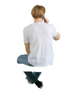 video of a young man sitting seen from back angle
