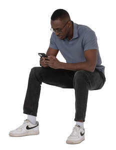 cut out black man sitting and texting