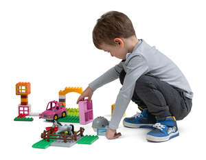 cut out little boy playing with toys