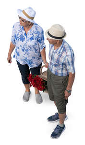 top view of two elderly people standing with a basket