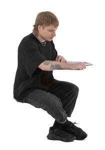 cut out young man sitting and reading a book