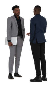 two men standing and talking business