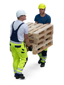 two workers carrying pallets seen from above