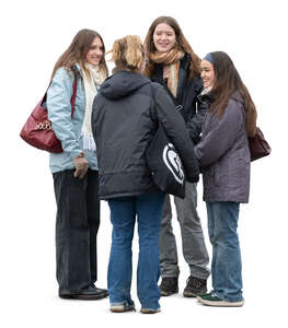 four cut out women standing happily together