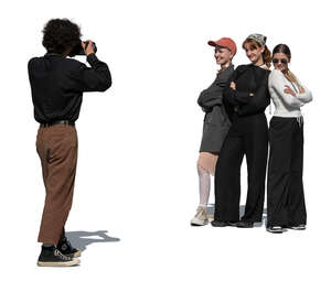 man taking a photo of a group of girls