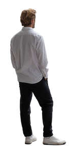 man standing by the door and looking outside