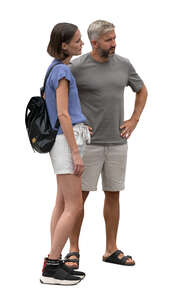 man and woman standing and looking at smth