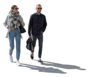 two cut out backlit people walking
