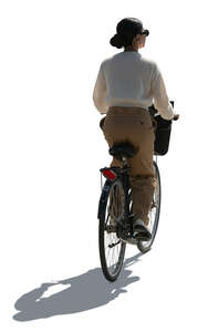 cut out backlit woman riding a bicycle