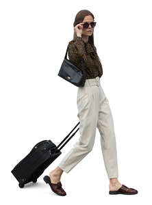 cut out woman with a suitcase walking