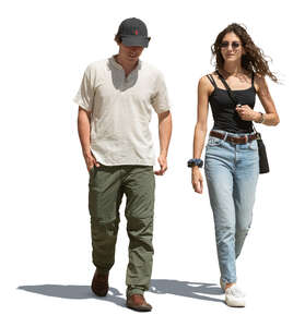 two cut out people walking outside in the street