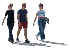 cut out backlit group of three people walking