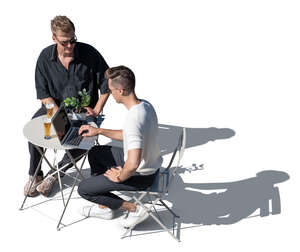 top view of two men sitting in a cafe
