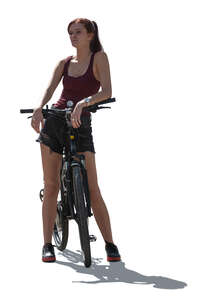 cut out backlit woman with a bike standing