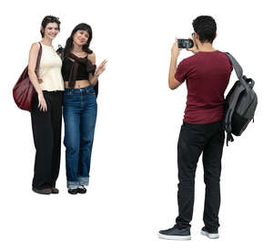 cut out man taking a picture of two women